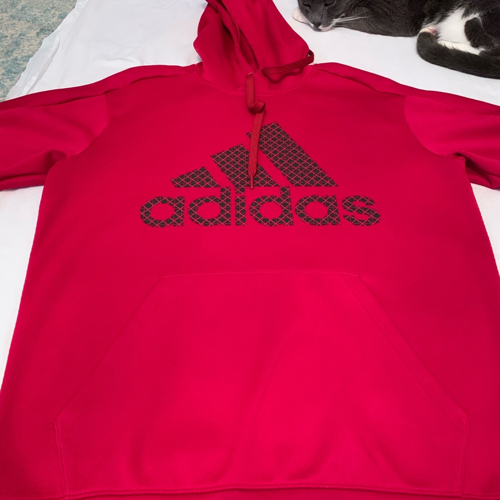 New, Adidas red hoodie size M, 100% polyester “CLIMAWARM” written on back.